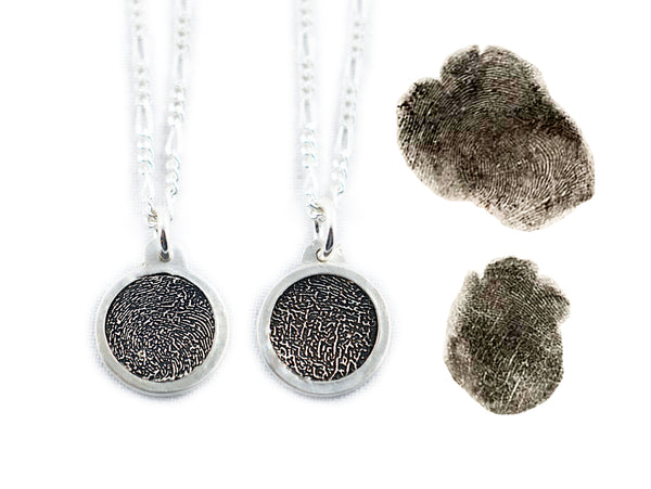 Double Sided Fingerprints on a Bordered Circle Shaped Silver Pendant